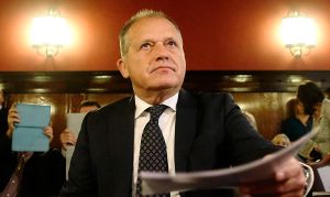 Former Austrian Interior Minister and Member of the European Parliament Strasser sits in the dock as he waits for his trial at Austria's supreme court in Vienna